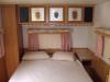 Private bedroom with double bed in PU 12 Trailer (Sheets and Pillows provided but no blanket or comforter)